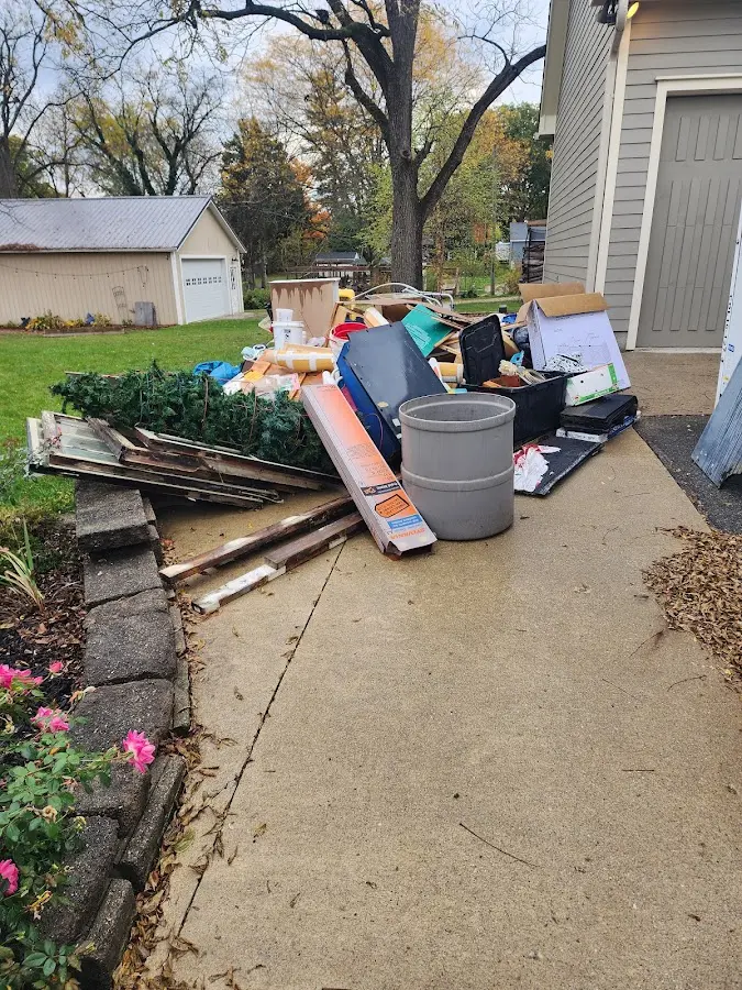 Dumpster being loaded with debris for 12 Yard Dumpster Rental in Marbletown